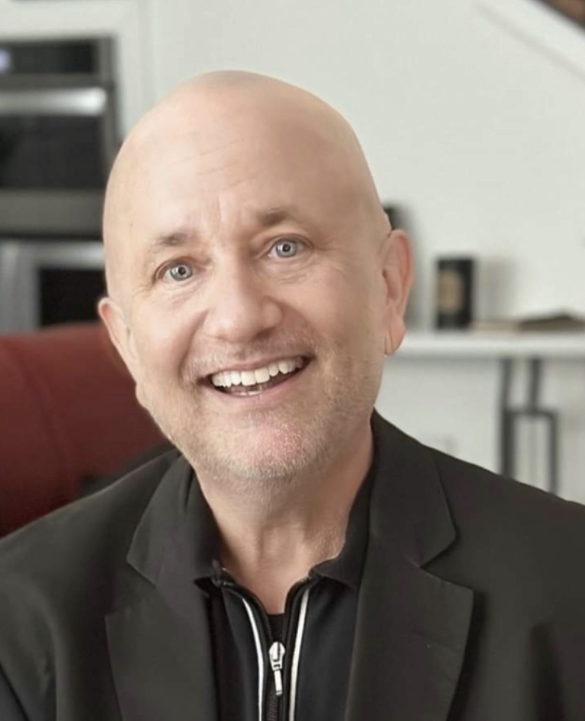 J. Jay Jones smiling in a black jacket